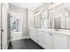 Double vanity bathroom with hexagon tile floors at 1179 Cottonsprings Dr, Wendell, NC 27591