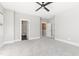 Spacious bedroom with ceiling fan and access to bathroom and hallway at 1179 Cottonsprings Dr, Wendell, NC 27591