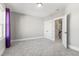 Spacious bedroom with carpet and neutral walls. Features a large window and ample closet space at 1179 Cottonsprings Dr, Wendell, NC 27591