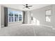 Bright bedroom with large windows and grey carpet at 1179 Cottonsprings Dr, Wendell, NC 27591