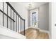 Bright entryway with modern light fixture and stairs at 1179 Cottonsprings Dr, Wendell, NC 27591
