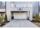 Attached garage with basketball hoop at 1179 Cottonsprings Dr, Wendell, NC 27591