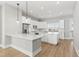 Modern kitchen featuring white cabinets and granite countertops at 1179 Cottonsprings Dr, Wendell, NC 27591