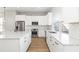 Modern kitchen with stainless steel appliances and white cabinets at 1179 Cottonsprings Dr, Wendell, NC 27591