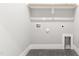 Laundry room with a built-in shelf and tile flooring at 1179 Cottonsprings Dr, Wendell, NC 27591