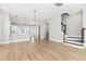 Open living room with hardwood floors and modern staircase at 1179 Cottonsprings Dr, Wendell, NC 27591