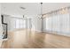 Spacious living room with hardwood floors and large windows at 1179 Cottonsprings Dr, Wendell, NC 27591