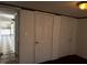 A bedroom view shows checkerboard flooring with multiple white doors, and natural lighting at 165 Wakeline Dr, Wendell, NC 27591