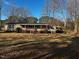 Single-wide manufactured home with covered porch and large yard at 165 Wakeline Dr, Wendell, NC 27591