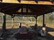 A spacious outdoor gazebo is set up for entertaining and dining, enhancing the backyard's appeal at 165 Wakeline Dr, Wendell, NC 27591
