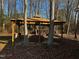 A charming outdoor gazebo provides a versatile space for entertaining, relaxing, or enjoying the natural surroundings at 165 Wakeline Dr, Wendell, NC 27591