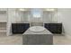 Double vanity bathroom with soaking tub and dark cabinets at 1819 Capstone Dr, Durham, NC 27713
