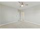 Spacious bedroom with neutral carpet and ceiling fan at 1819 Capstone Dr, Durham, NC 27713
