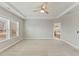 Main bedroom with trey ceiling, carpet, and ensuite bath at 1819 Capstone Dr, Durham, NC 27713