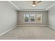 Spacious bedroom with neutral carpeting and large windows at 1819 Capstone Dr, Durham, NC 27713