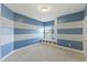 Blue and white striped bedroom with built-in shelving at 1819 Capstone Dr, Durham, NC 27713