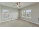 Bright bedroom with neutral carpet and ceiling fan at 1819 Capstone Dr, Durham, NC 27713
