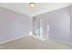 Simple bedroom with light purple walls and carpet at 1819 Capstone Dr, Durham, NC 27713