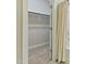 Walk-in closet with carpeted flooring and hanging rod at 1819 Capstone Dr, Durham, NC 27713
