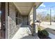 Spacious front porch with brick columns and a view of the neighborhood at 1819 Capstone Dr, Durham, NC 27713