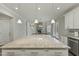 Large kitchen island with granite countertop and pendant lighting at 1819 Capstone Dr, Durham, NC 27713