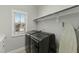 Laundry room with washer, dryer, and overhead shelving at 1819 Capstone Dr, Durham, NC 27713