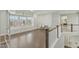 Bright loft area with built-in shelving and hardwood floors at 1819 Capstone Dr, Durham, NC 27713
