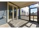 Screened porch with double doors and view of backyard at 1819 Capstone Dr, Durham, NC 27713