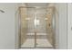 Large walk-in shower with glass enclosure and built-in seat at 1819 Capstone Dr, Durham, NC 27713