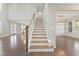 Elegant staircase with wooden railings and neutral colors at 1819 Capstone Dr, Durham, NC 27713