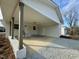 Attached carport with ample space for two vehicles and extra storage at 209 Carolyn Dr, Benson, NC 27504