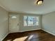 Inviting entryway with a charming front door and large windows at 209 Carolyn Dr, Benson, NC 27504