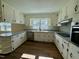 Updated kitchen features granite countertops and stainless steel appliances at 209 Carolyn Dr, Benson, NC 27504