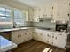 Renovated kitchen with granite countertops and new cabinets at 209 Carolyn Dr, Benson, NC 27504