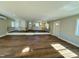 Open living room with hardwood floors and kitchen view at 209 Carolyn Dr, Benson, NC 27504