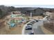 Aerial view showcases the Joyner Park playground with colorful play structures and an adjacent parking area at 210 W Oak Ave, Wake Forest, NC 27587