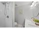 Renovated bathroom with a walk-in shower, sleek hardware, and modern vanity at 210 W Oak Ave, Wake Forest, NC 27587