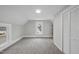Neutral bedroom with carpet, two large windows, and closet at 210 W Oak Ave, Wake Forest, NC 27587