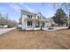 Charming two-story home with a inviting front porch and landscaping at 210 W Oak Ave, Wake Forest, NC 27587
