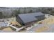 Joyner Park Community Center showcases modern architecture with a playground, parking, and lush landscaping, offering a vibrant community hub at 210 W Oak Ave, Wake Forest, NC 27587
