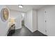 Hallway features an entryway to the bathroom with modern tile floors at 210 W Oak Ave, Wake Forest, NC 27587