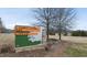 Close up of the park welcome sign with road and trees in background at 210 W Oak Ave, Wake Forest, NC 27587