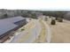 Aerial view shows roads and walking paths around the Joyner Park Community Center and a wooded backdrop at 210 W Oak Ave, Wake Forest, NC 27587