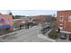 Street view with shops and parking spots at 210 W Oak Ave, Wake Forest, NC 27587