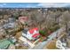 Aerial view of a neighborhood with a white house featuring a red roof at 211 Long Ave, Graham, NC 27253