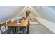 Bonus room with a wooden table, chairs, games, and pitched ceilings at 211 Long Ave, Graham, NC 27253
