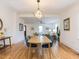 Elegant dining room with hardwood floors, open layout, and stylish decor flowing into the bright living space at 211 Long Ave, Graham, NC 27253