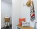 Charming entryway area with a wooden bench, decorative pillows, and stylish decor at 211 Long Ave, Graham, NC 27253
