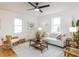 Bright living room with hardwood floors, modern decor, and a comfortable seating area at 211 Long Ave, Graham, NC 27253