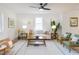 Cozy living room with neutral tones, stylish decor, hardwood floors, and a comfortable seating arrangement at 211 Long Ave, Graham, NC 27253